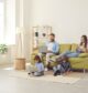 Family relaxing in their living room while using fast home internet