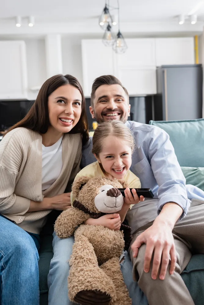 A family at home using devices on an AT&T internet connection